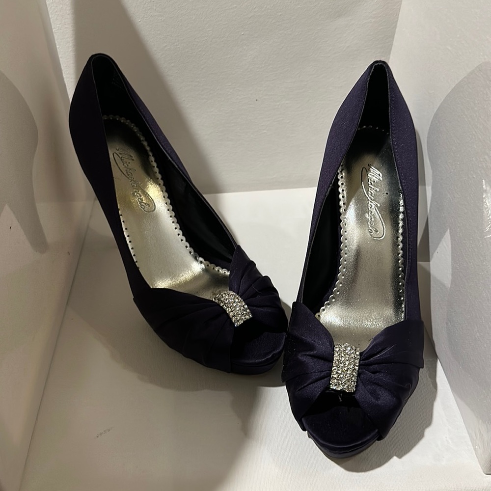 Purple heels. 8.5. Worn once at my wedding. Great condition